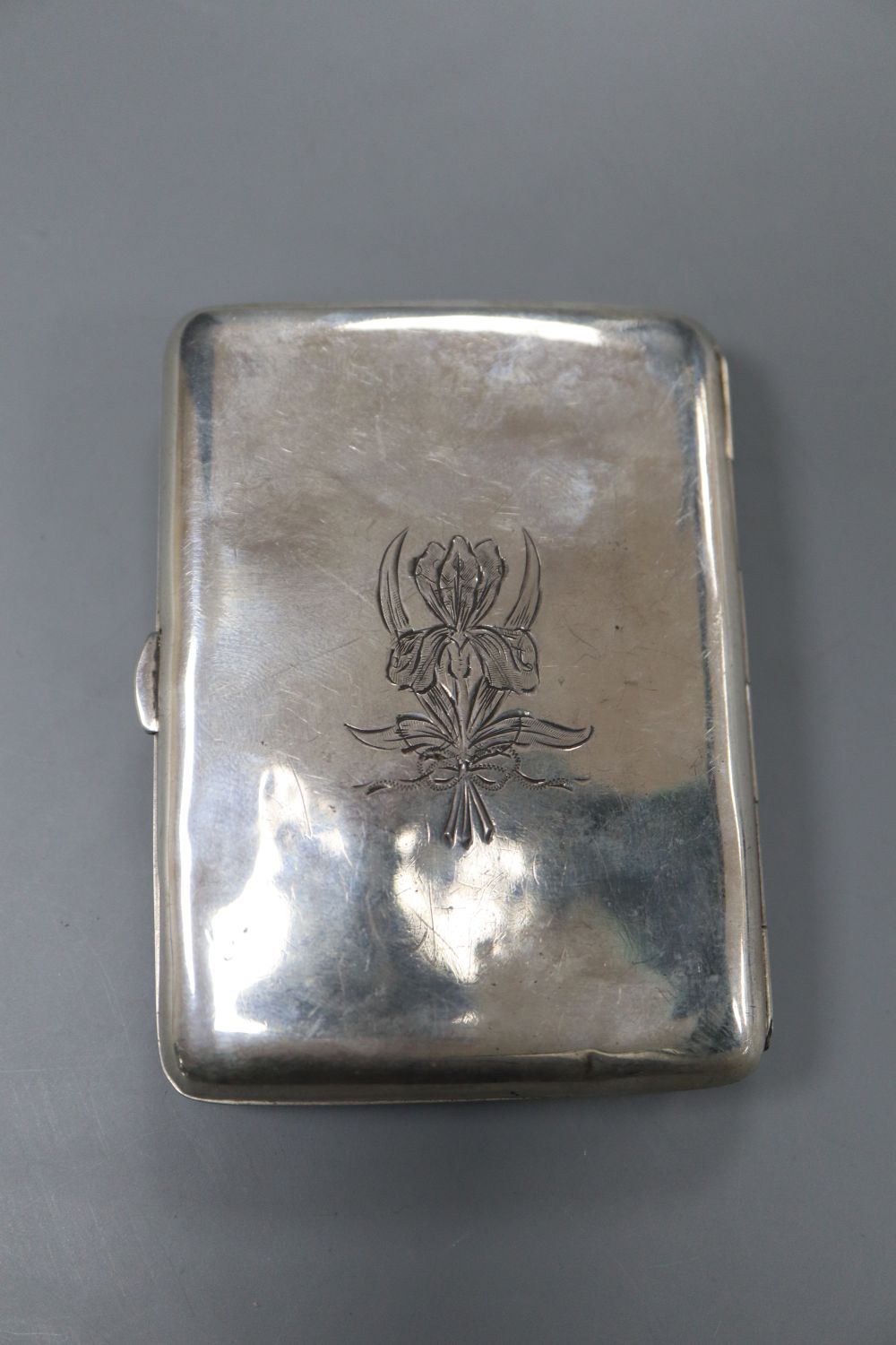A Victorian silver handled tortoiseshell letter opener(a.f.) 25.6cm and a white metal and enamelled cigarette case, 83mm.